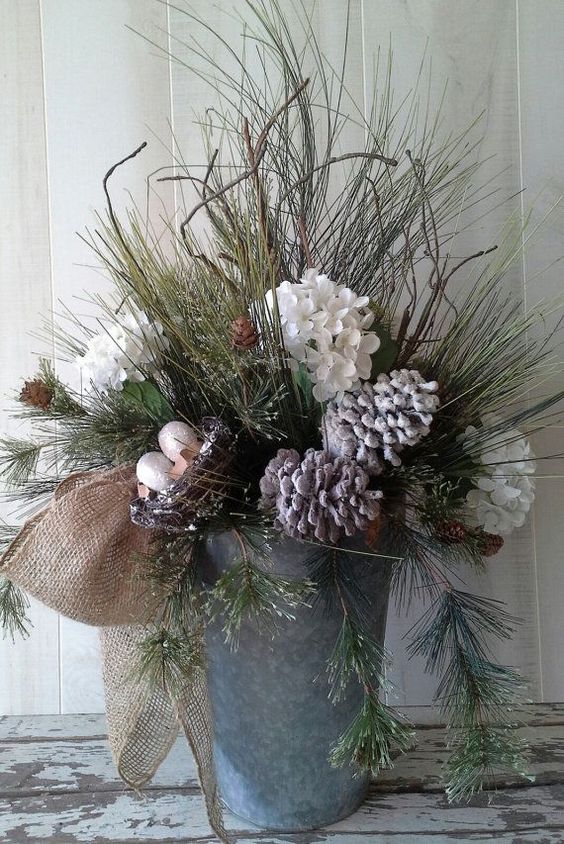 23-a-bucket-with-evergreens-snowy-pinecones-and-flowers