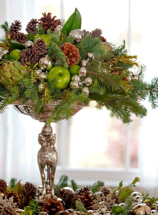 28-a-silver-stand-with-oraments-pinecones-evergreens-and-ggreen-apples