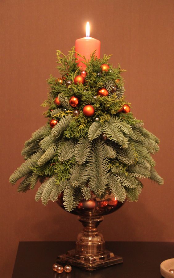29-a-simple-small-arrangement-with-a-candles-evergreens-and-tiny-copper-ornaments