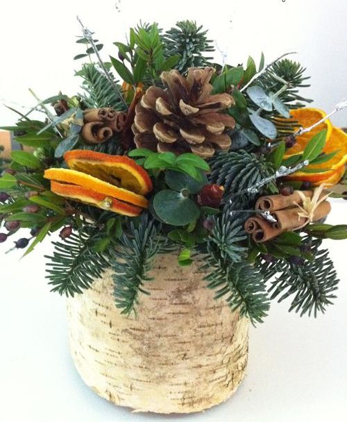 31-a-vase-wrapped-with-bark-evergreens-pincones-citrus-and-cinnamon-sticks